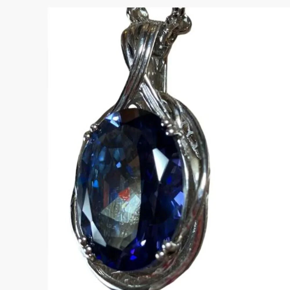 Handcrafted Multifaceted Simulated Sapphire With Silver Plated Chain